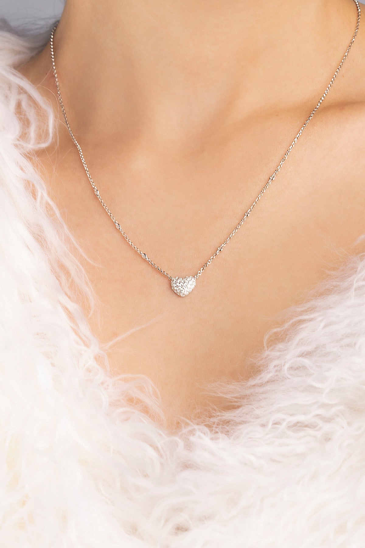 APM MONACO heart-shaped adjustable necklace worn on model